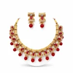 Gold plated kundan necklace set for women with red stones and pearls traditional bridal jewellery white background