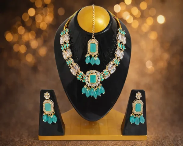 Turquoise stone bridal jewellery set with necklace, earrings and maang tikka on black display, premium festive design for women