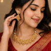 Gold plated temple choker necklace set worn by woman with matching earrings traditional bridal jewellery