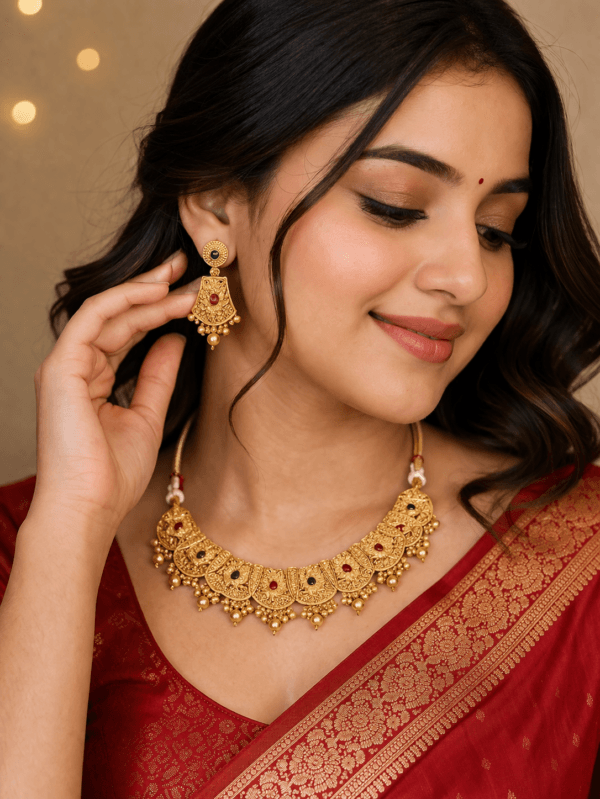 Gold plated temple choker necklace set worn by woman with matching earrings traditional bridal jewellery